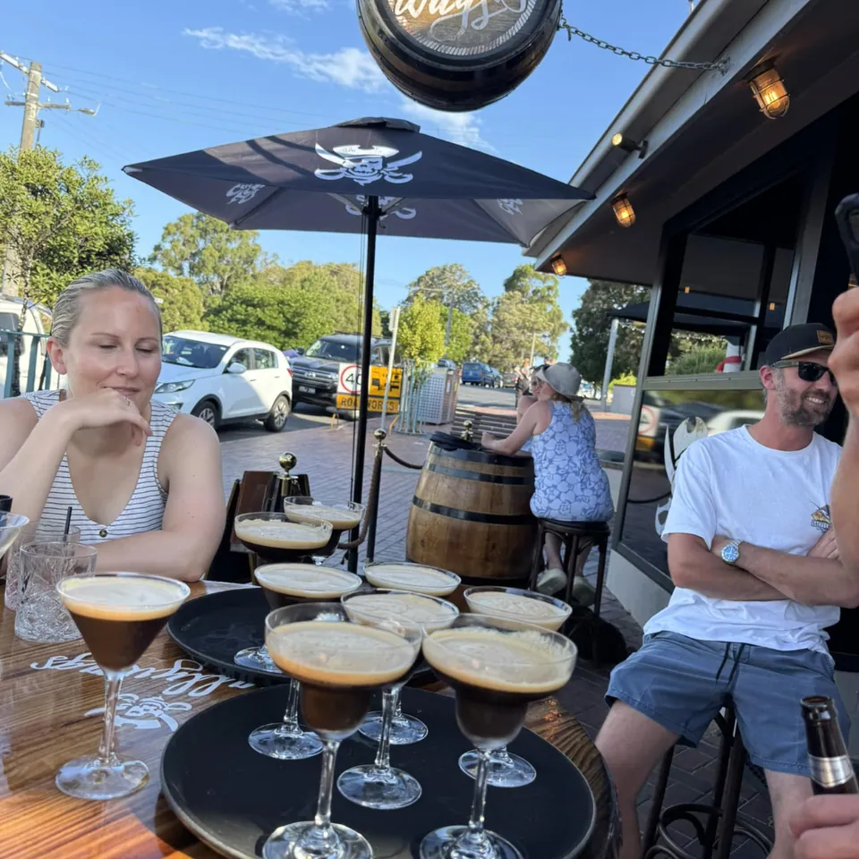 Tray of espresso martinis in sunny outdoor setting