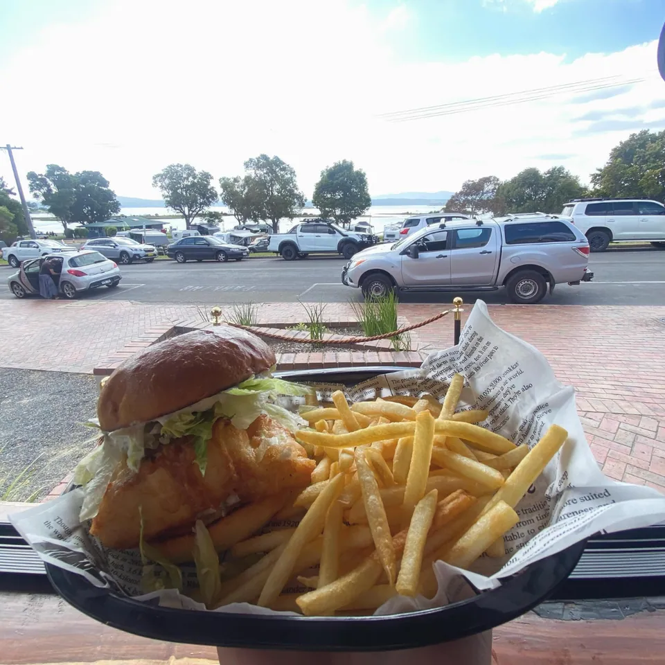 Gummy shark burger with scenic lake view backdrop