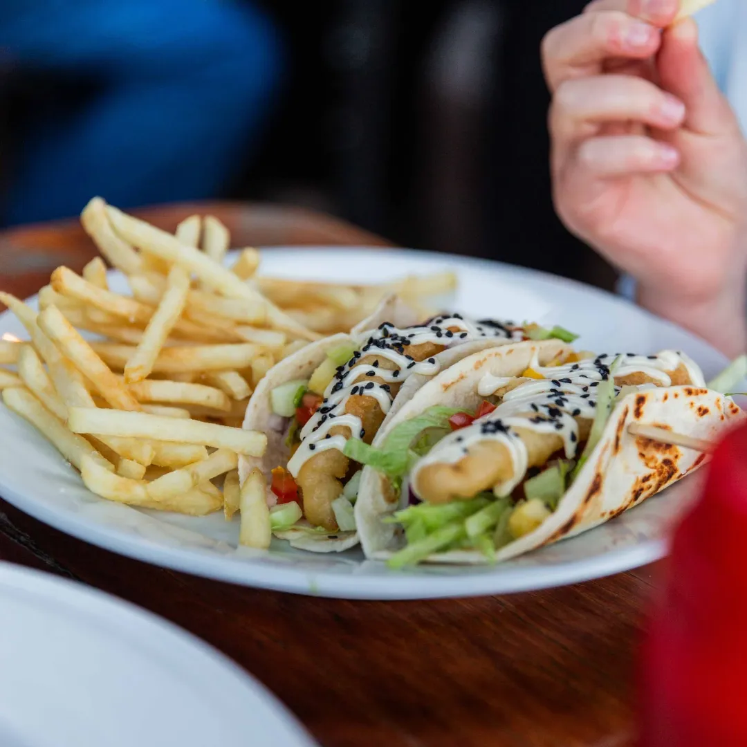 Fresh fish tacos with tropical garnish