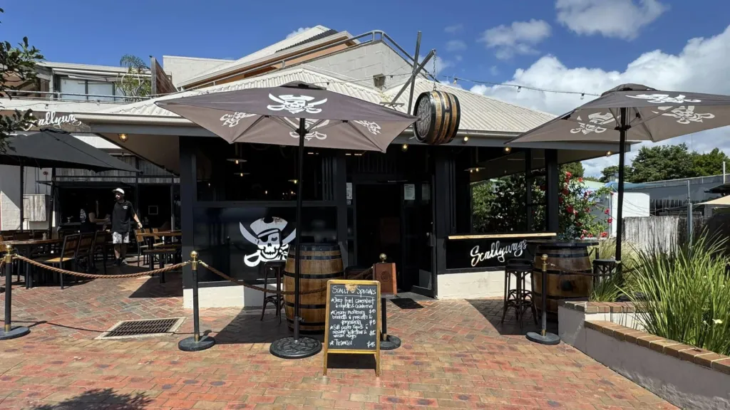 Scallywags Restaurant waterfront dining scene set for bookings, with sunset views over Mallacoota inlet