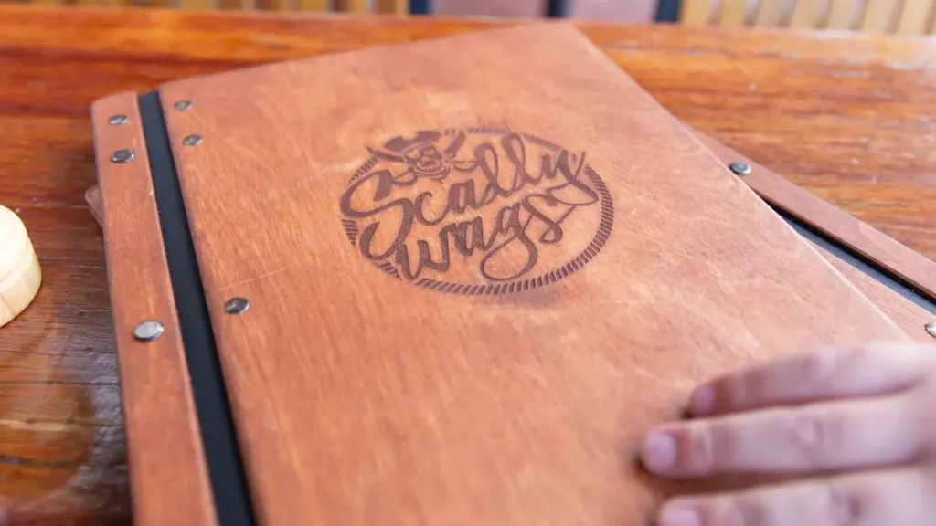 Scallywags Restaurant fresh seafood and menu items beautifully presented on waterfront dining table